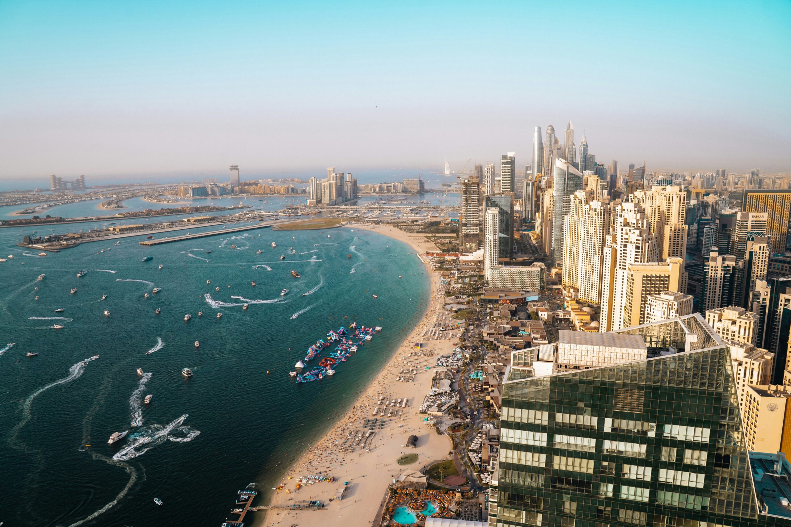 Aerial view of Dubai Marina and JBR beach, a sought-after area for selling property in Dubai